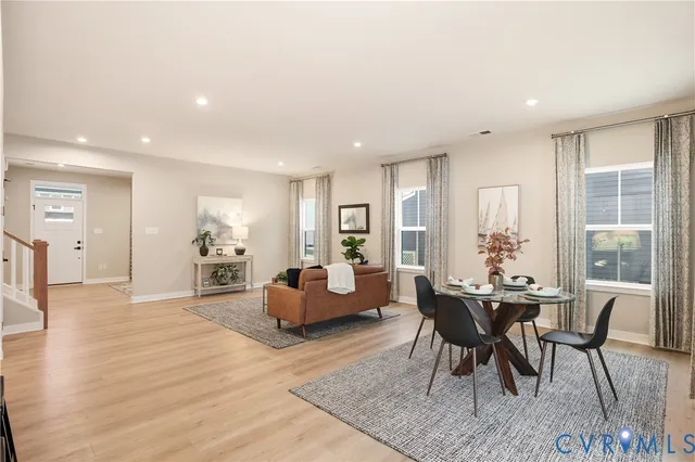 a view of a livingroom with furniture and wooden floor