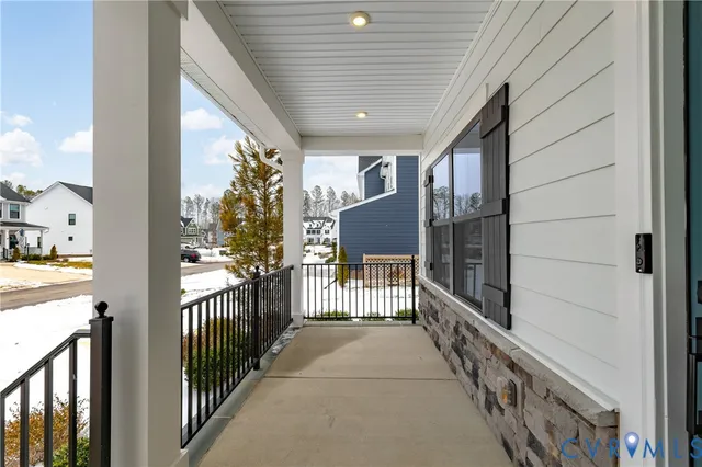 a view of a porch with wooden floor