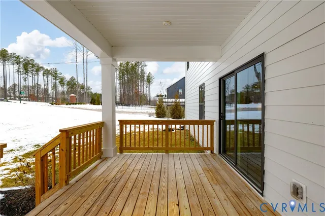 a view of a porch with wooden floor