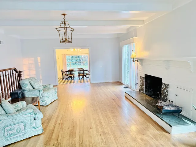 a dining room with a table and chairs