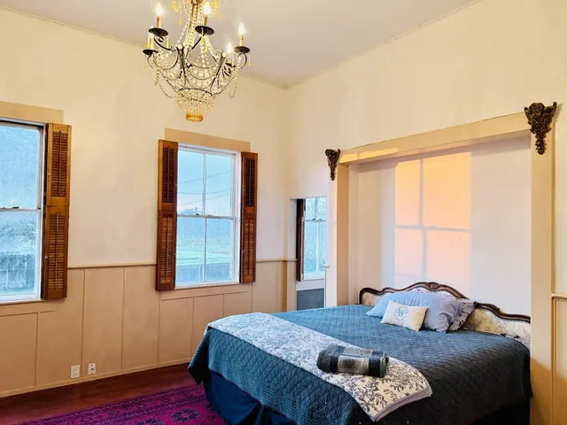 a bathroom with a double vanity sink and mirror