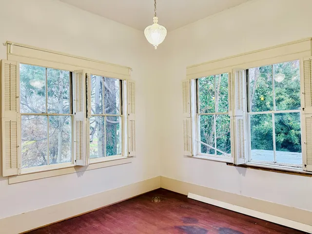 a view of a house with backyard and porch