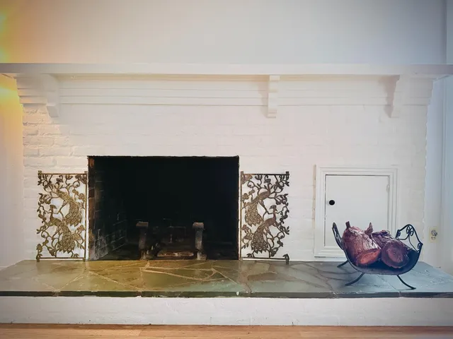 a view of a dining room with furniture and a potted plant