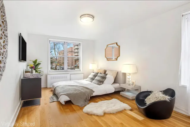 a bedroom with bed and a window