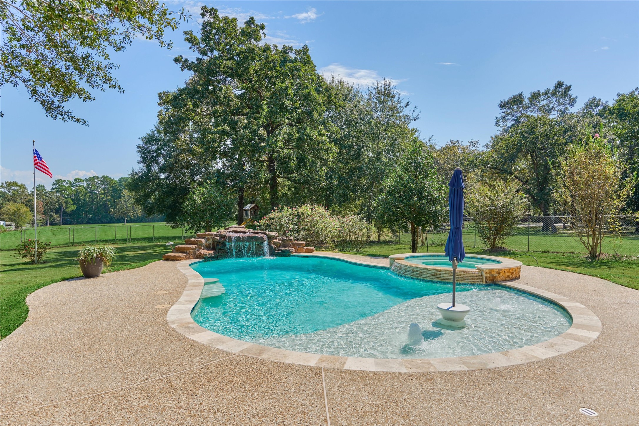 16024 Rabon Chapel Road Montgomery, TX 77316 - Photo 2 of 43 A chlorine pool and hot tub were added in 2021 and feature a tanning ledge, stacked stone accents around the hot tub and natural rock waterfall for the calming sound of running water. The pool is 7 feet deep.