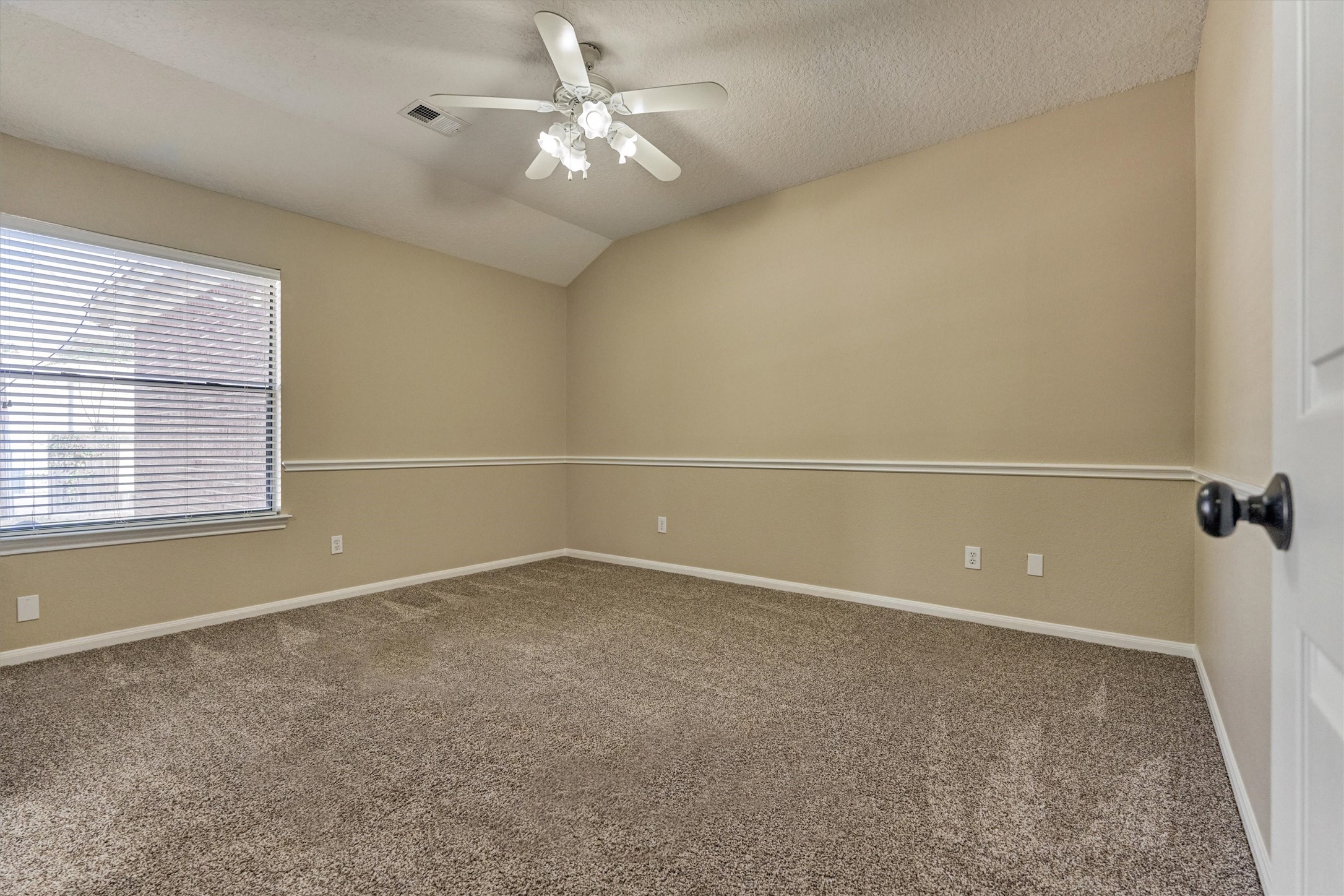 16024 Rabon Chapel Road Montgomery, TX 77316 - Photo 28 of 43 Secondary bedroom has fresh paint, newer carpet and chair rail molding to add a custom touch. This bedroom shares a jack and jill style bath with another guest bedroom and features a private sink area and spacious walk in closet.