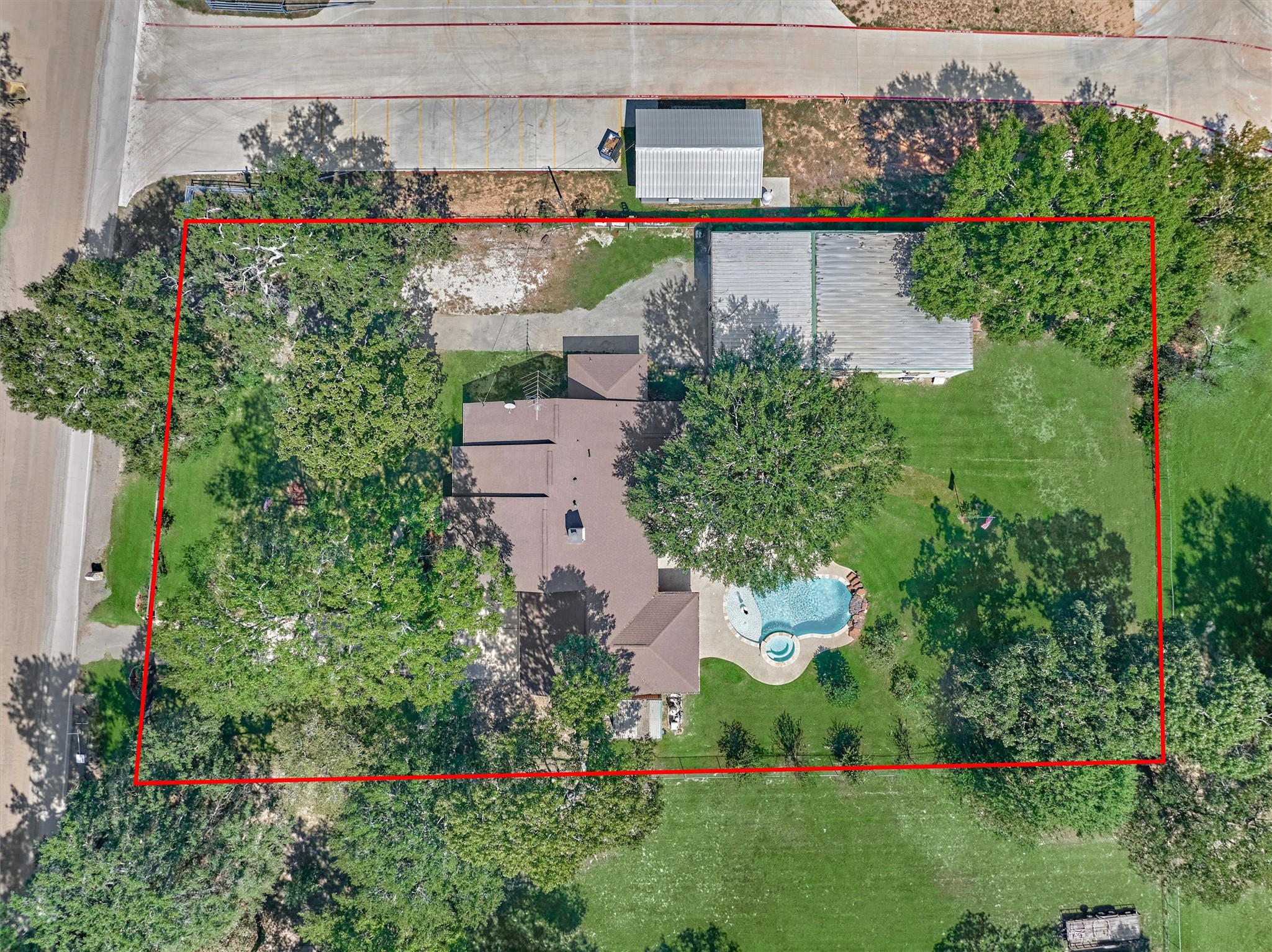 16024 Rabon Chapel Road Montgomery, TX 77316 - Photo 3 of 43 A birds eye view of the property shows the home, pool area, yard space and workshop with second driveway.