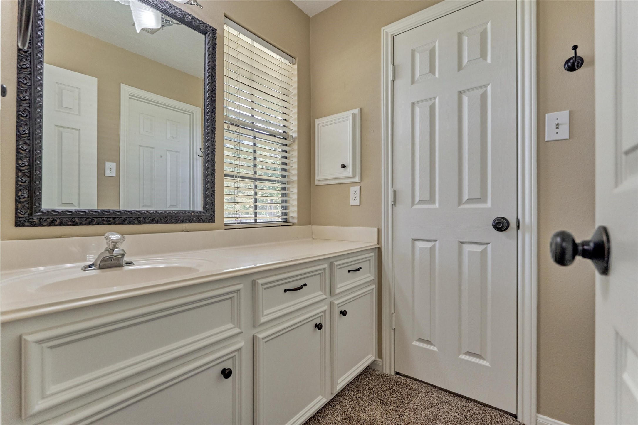 16024 Rabon Chapel Road Montgomery, TX 77316 - Photo 31 of 43 The guest bedroom has a sink area with great storage space. A charming window overlooks the front yard and fills the room with natural light. The door leads to a walk in closet.