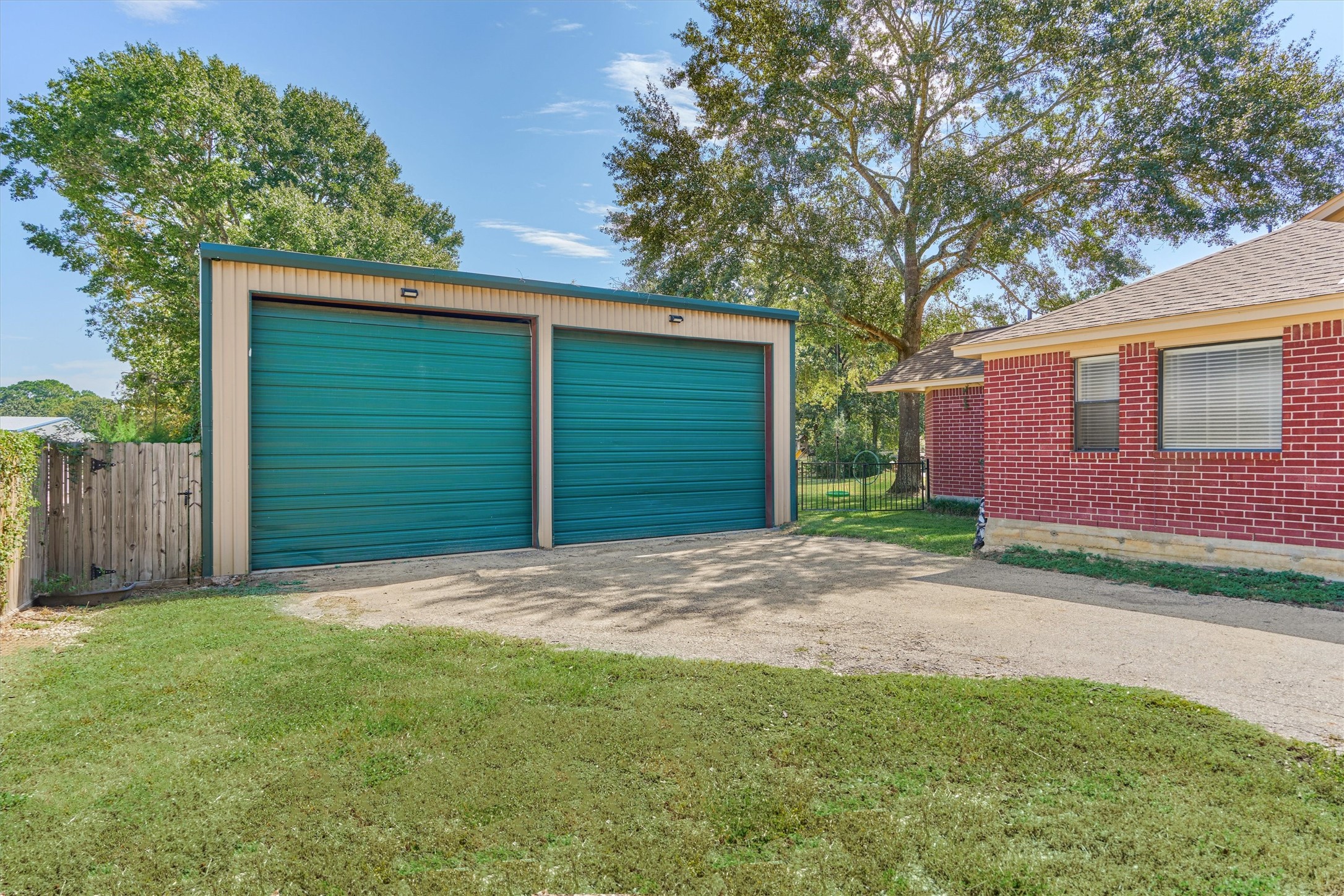 16024 Rabon Chapel Road Montgomery, TX 77316 - Photo 34 of 43 The workshop on the property features a private, gated driveway, two 12' roll up doors and a 50 amp plug for an RV inside the shop and another on the side of the house.