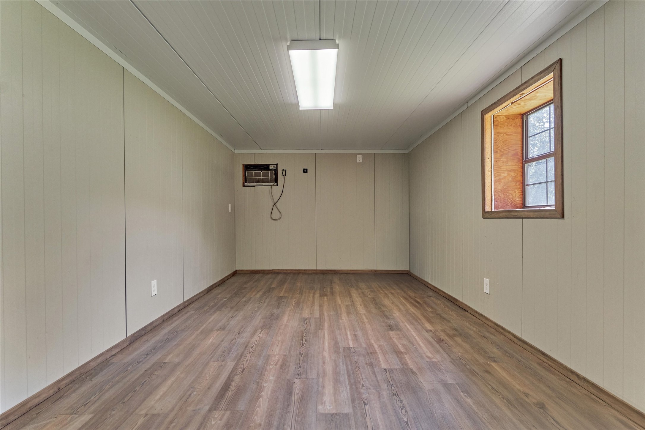 16024 Rabon Chapel Road Montgomery, TX 77316 - Photo 37 of 43 The office area in the shop is 10' x 18' and features an a/c unit and is plumbed for future sink and toilet.