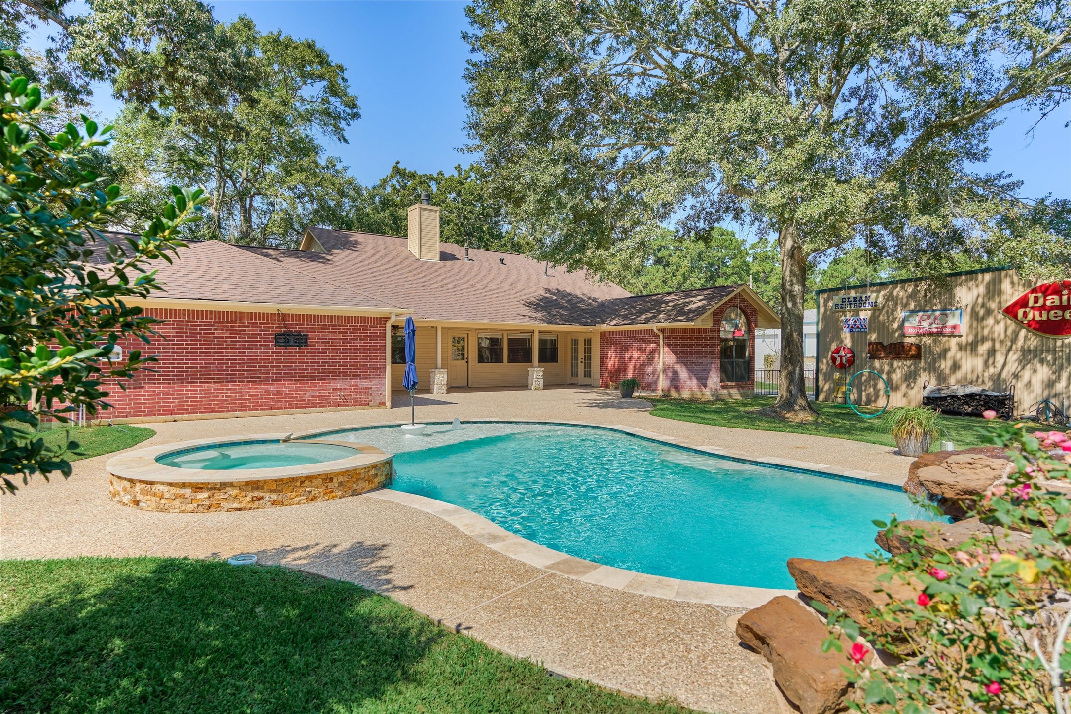 16024 Rabon Chapel Road Montgomery, TX 77316 - Photo 41 of 43 Expansive decking surrounds the pool, offering abundant space for seating and entertaining.