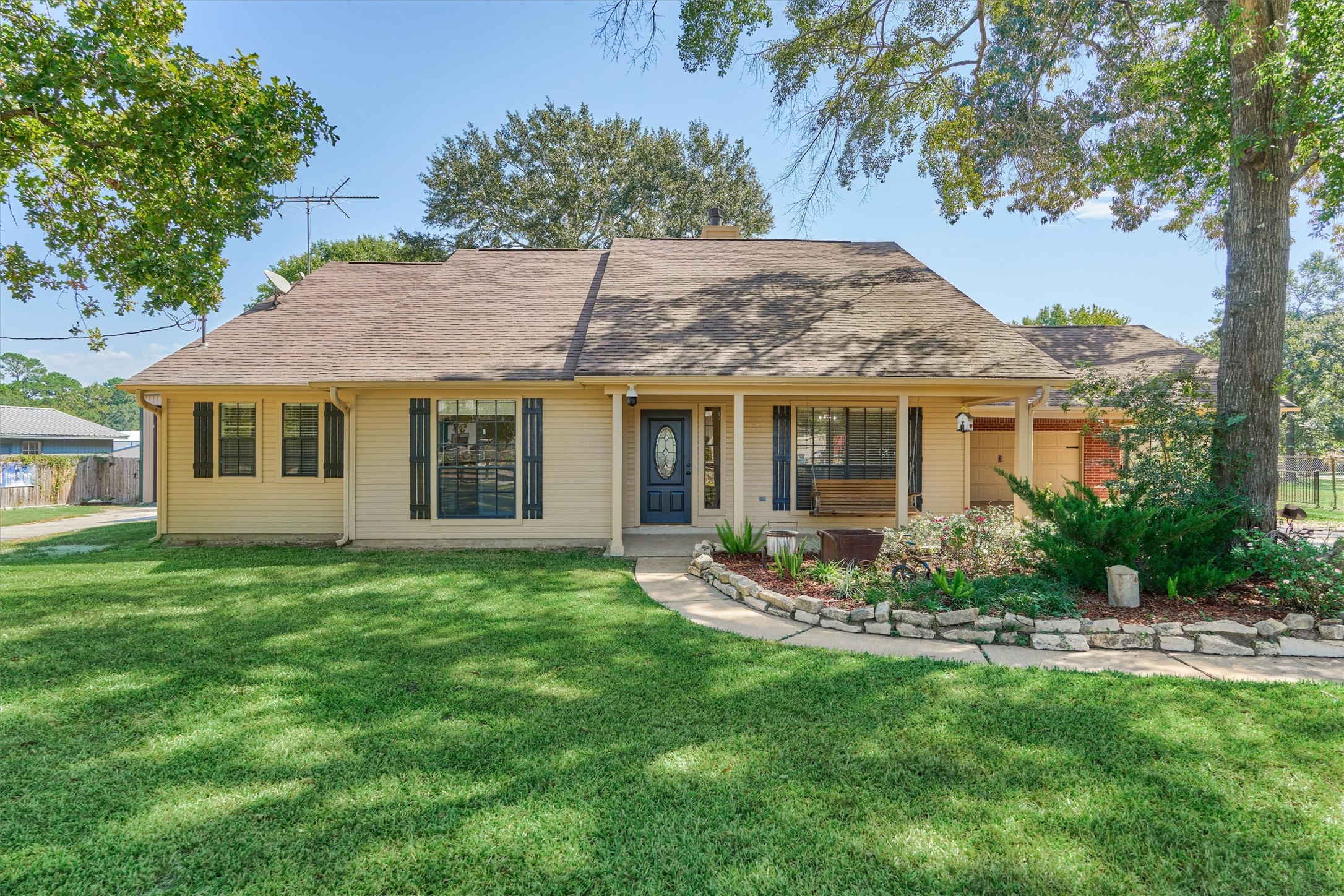 16024 Rabon Chapel Road Montgomery, TX 77316 - Photo 9 of 43 A tranquil, tree-shaded front yard and a freshly painted exterior give this home charming curb appeal.