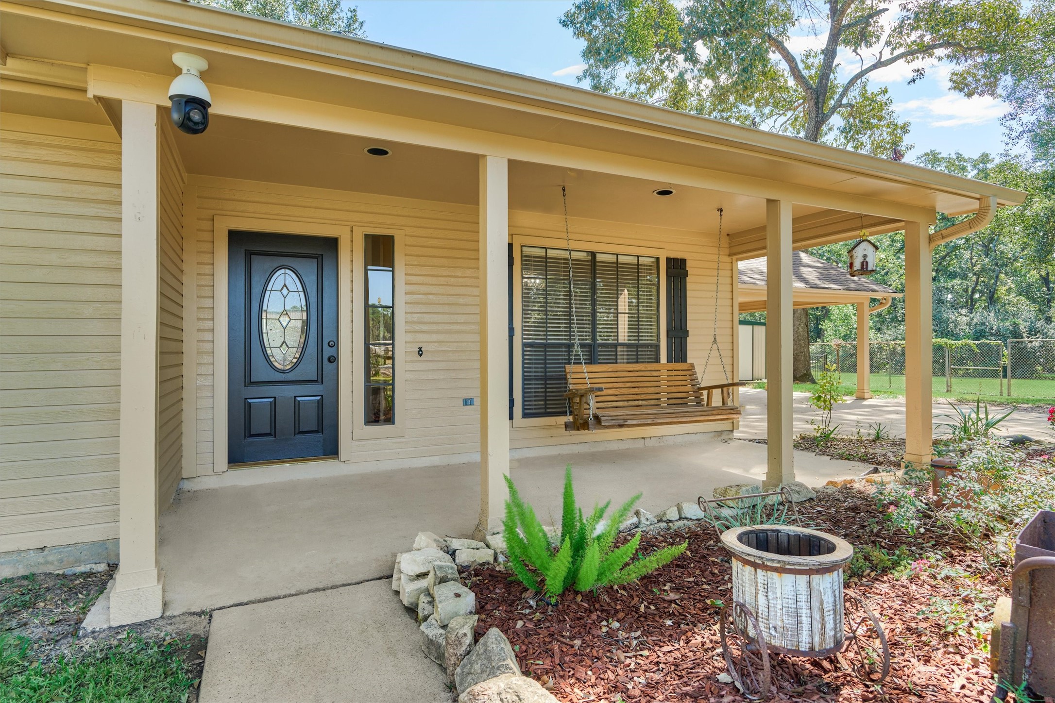 16024 Rabon Chapel Road Montgomery, TX 77316 - Photo 10 of 43 A covered front porch with swing provides a great place to enjoy the property.