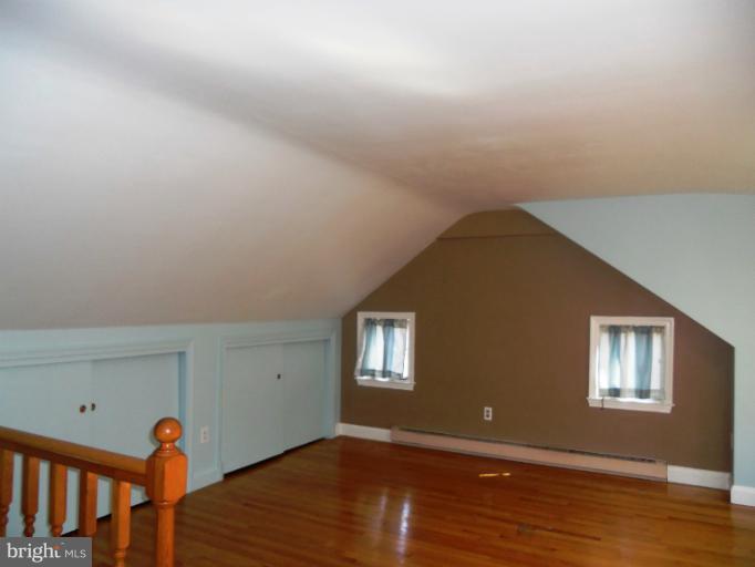 805 Tred Avon Road Baltimore, MD 21212 - Photo 3 of 19 a view of an empty room with wooden floor