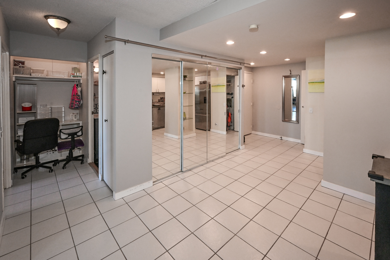 5320 North Sheridan Road, Unit 1011 Chicago, IL 60640 - Photo 13 of 37 a view of hallway with furniture and a refrigerator