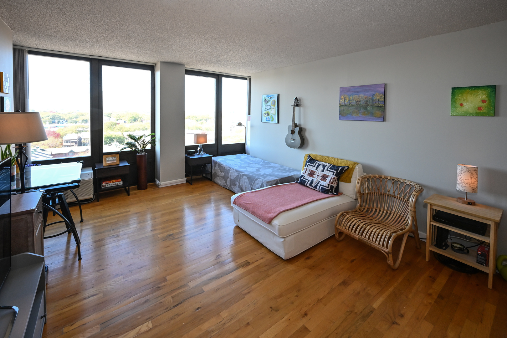 5320 North Sheridan Road, Unit 1011 Chicago, IL 60640 - Photo 6 of 37 a bedroom with wooden floor and a large window