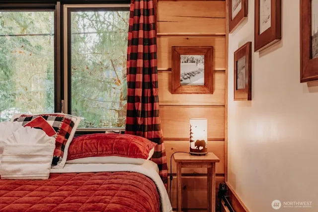 a bedroom with a large bed and a closet