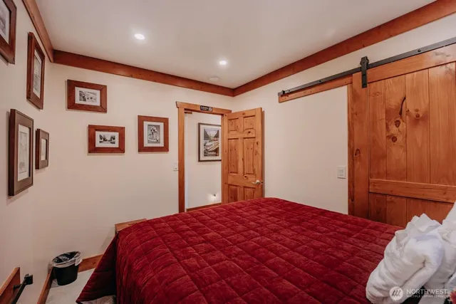 hallway with wooden floor and door
