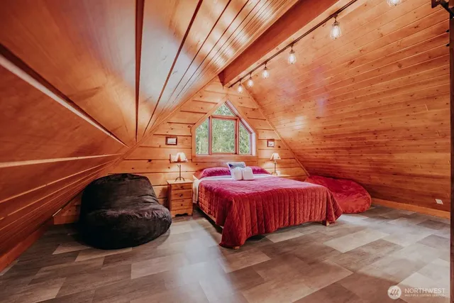 a bedroom with bed and window