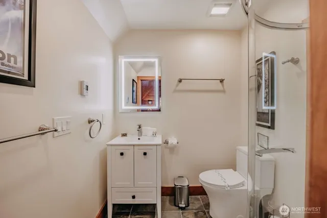 a bathroom with a shower and a curtain