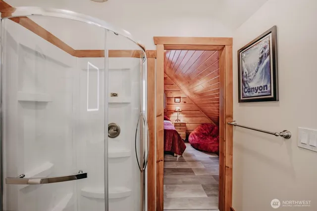 a bathroom with a shower and a toilet