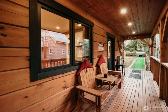 a view of swimming pool with seating area