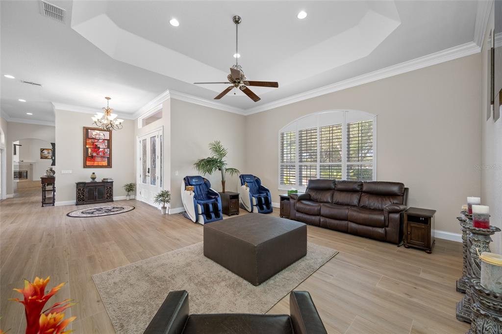 11939 Pasco Trails Boulevard Spring Hill, FL 34610 - Photo 11 of 61 a living room with furniture fireplace and a window