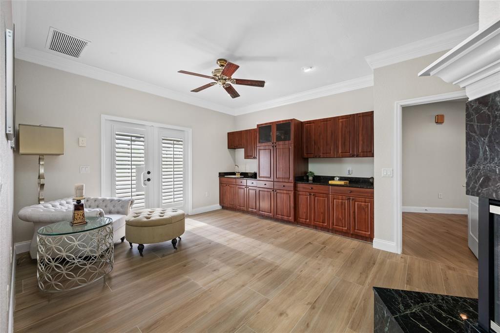 11939 Pasco Trails Boulevard Spring Hill, FL 34610 - Photo 14 of 61 a living room with furniture and a wooden floor