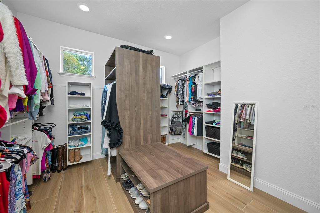11939 Pasco Trails Boulevard Spring Hill, FL 34610 - Photo 19 of 61 a view of a livingroom with furniture and storage