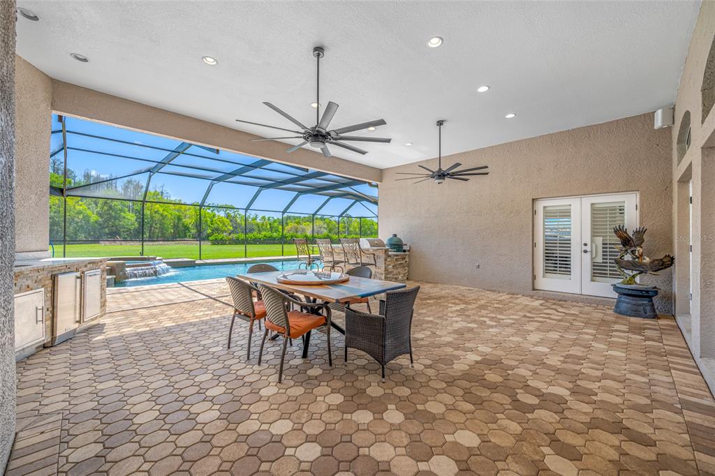 11939 Pasco Trails Boulevard Spring Hill, FL 34610 - Photo 49 of 61 a view of a dining room with furniture window and outside view