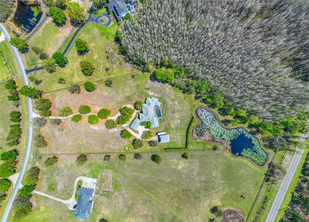 11939 Pasco Trails Boulevard Spring Hill, FL 34610 - Photo 57 of 61 a bathroom with a sink and mirror