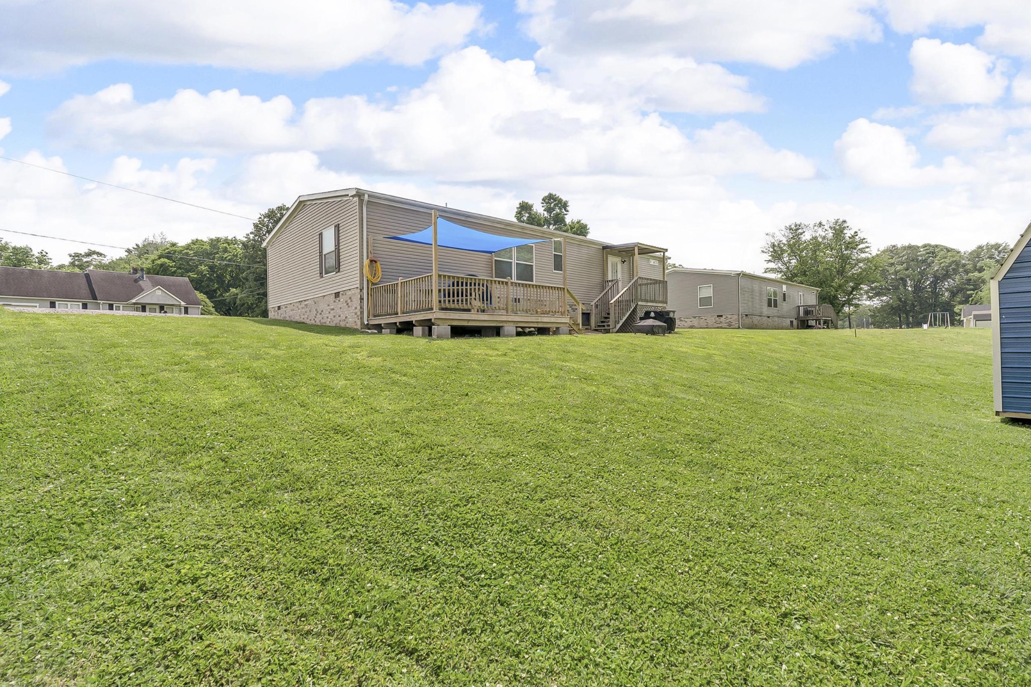 599 Days Road Lafayette, TN 37083 - Photo 22 of 32 a view of a large garden with plants and large trees