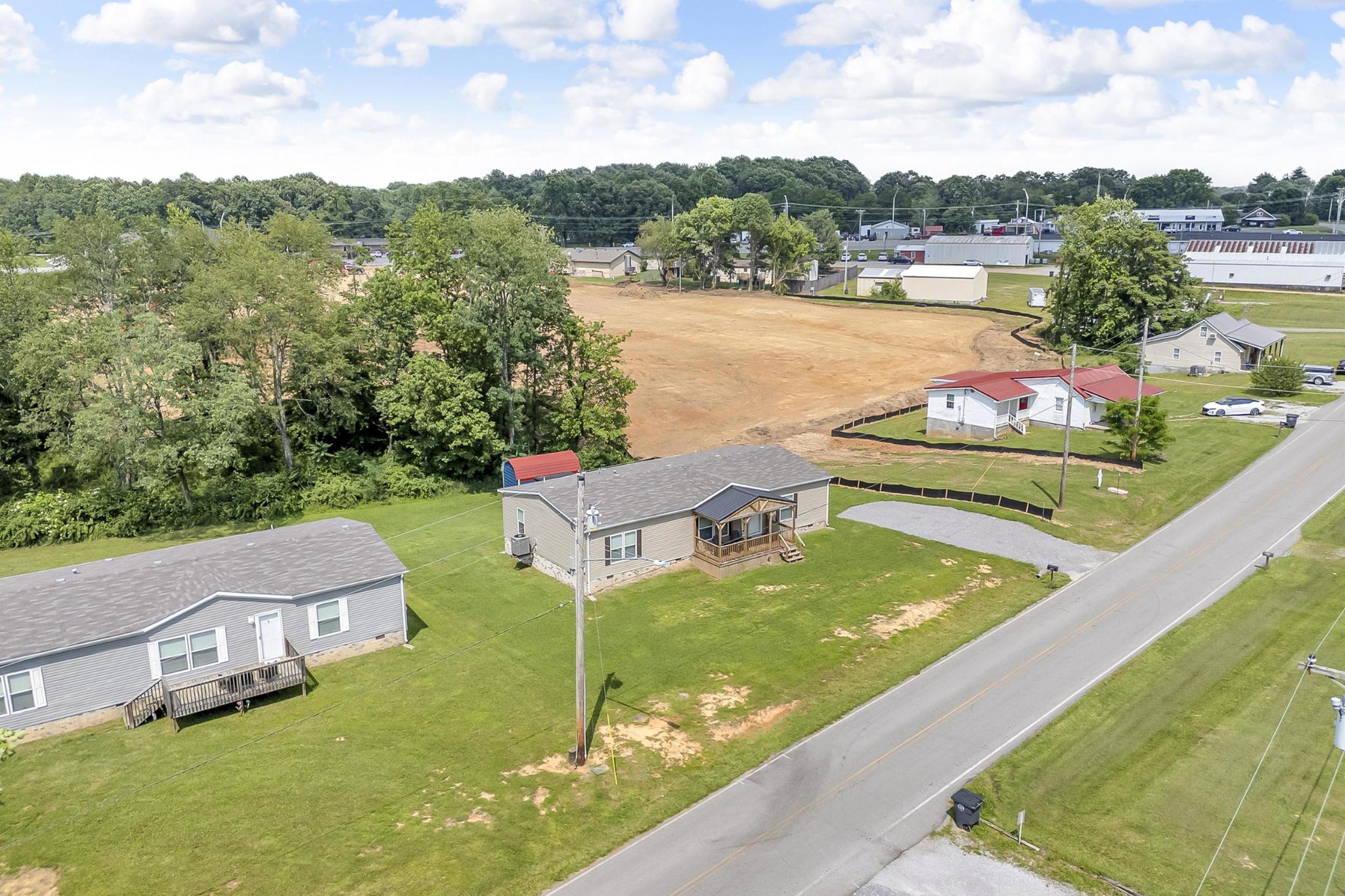 599 Days Road Lafayette, TN 37083 - Photo 31 of 32 a view of a lake with a garden and houses