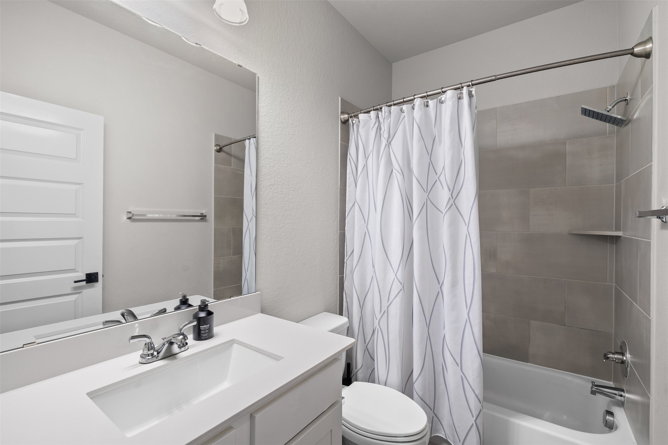341 Pisa Lane Georgetown, TX 78628 - Photo 26 of 31 a bathroom with a sink a toilet and shower