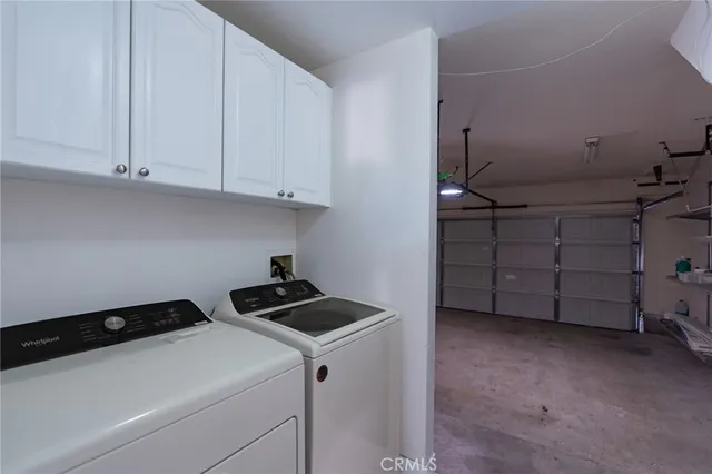 a kitchen with cabinets and a stove top oven