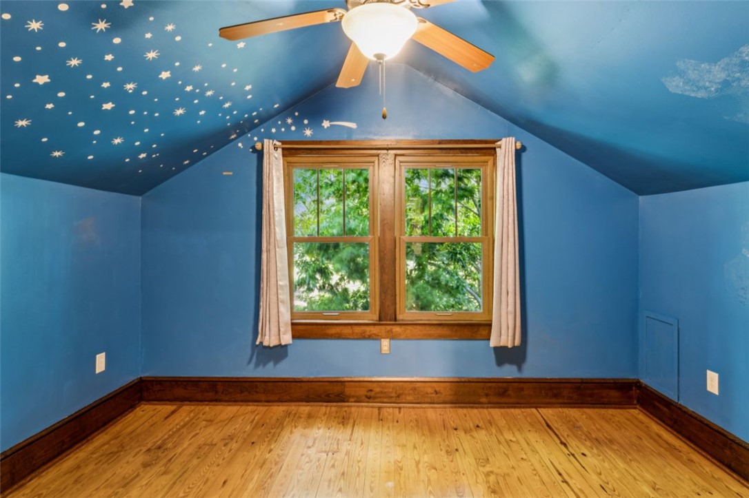 321 South Pine Street Walhalla, SC 29691 - Photo 27 of 32 Hardwood floors and a whimsical star-painted ceiling define this charming bedroom space.