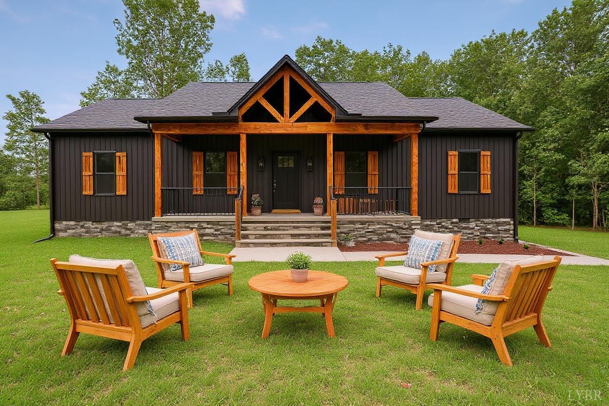 594 Community Road Dillwyn, VA 23936 - Photo 2 of 52 a backyard of a house with table and chairs