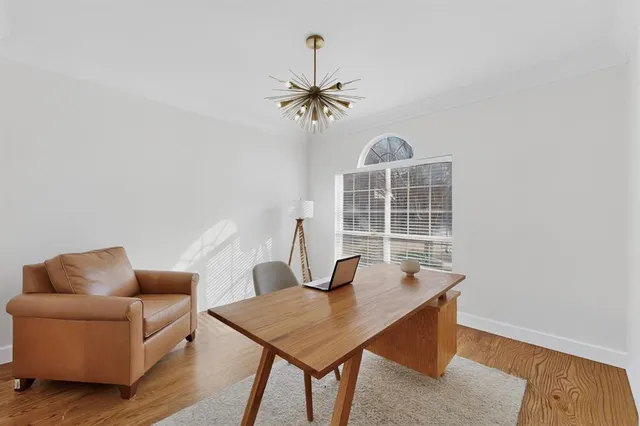 a view of a livingroom with furniture and wooden floor