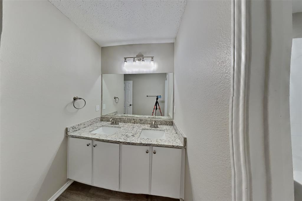 1320 Stetson Trail Saginaw, TX 76131 - Photo 15 of 19 a bathroom with a granite countertop sink and a mirror