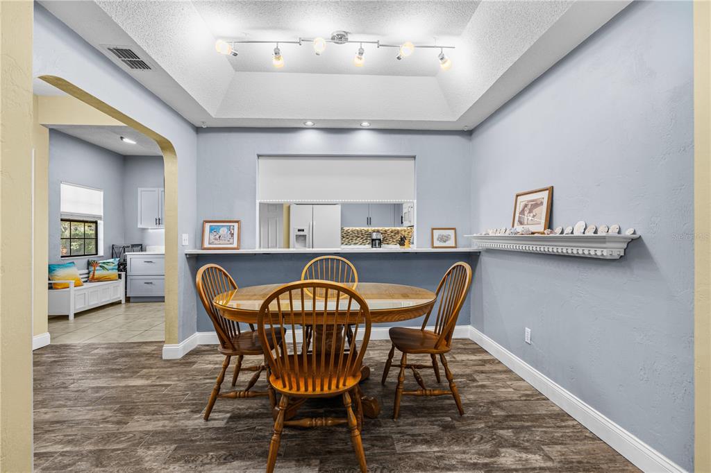 124 Rose Bank Road Daytona Beach, FL 32114 - Photo 18 of 43 a view of a dining room with furniture