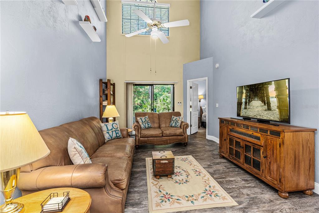 124 Rose Bank Road Daytona Beach, FL 32114 - Photo 19 of 43 a living room with furniture and a flat screen tv