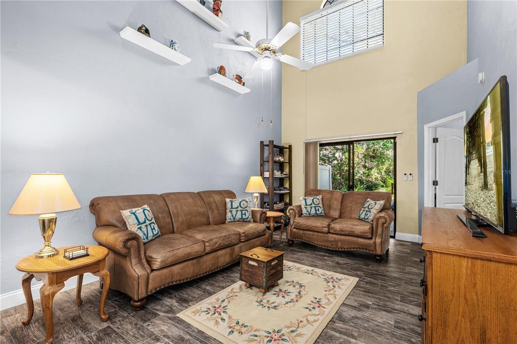 124 Rose Bank Road Daytona Beach, FL 32114 - Photo 20 of 43 a living room with furniture a rug and a flat screen tv
