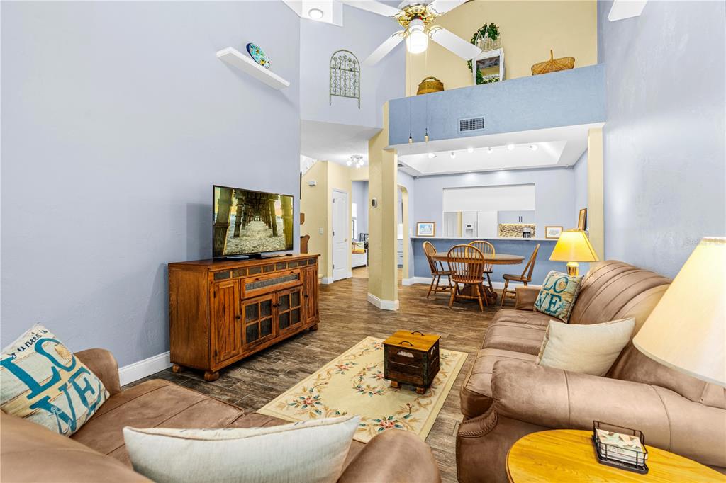 124 Rose Bank Road Daytona Beach, FL 32114 - Photo 21 of 43 a living room with furniture and a flat screen tv