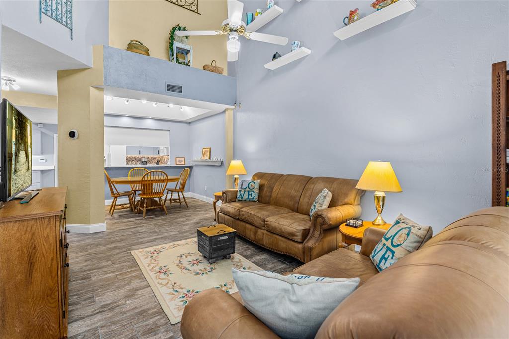 124 Rose Bank Road Daytona Beach, FL 32114 - Photo 22 of 43 a living room with furniture and a lamp