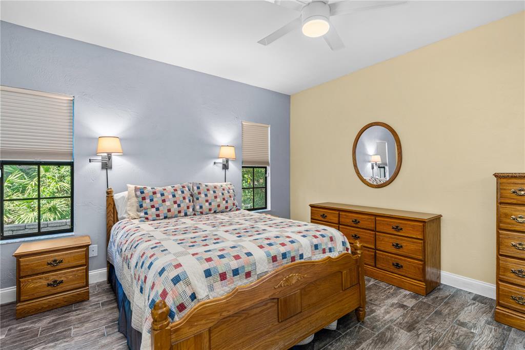 124 Rose Bank Road Daytona Beach, FL 32114 - Photo 27 of 43 a bedroom with a bed a closet and a window