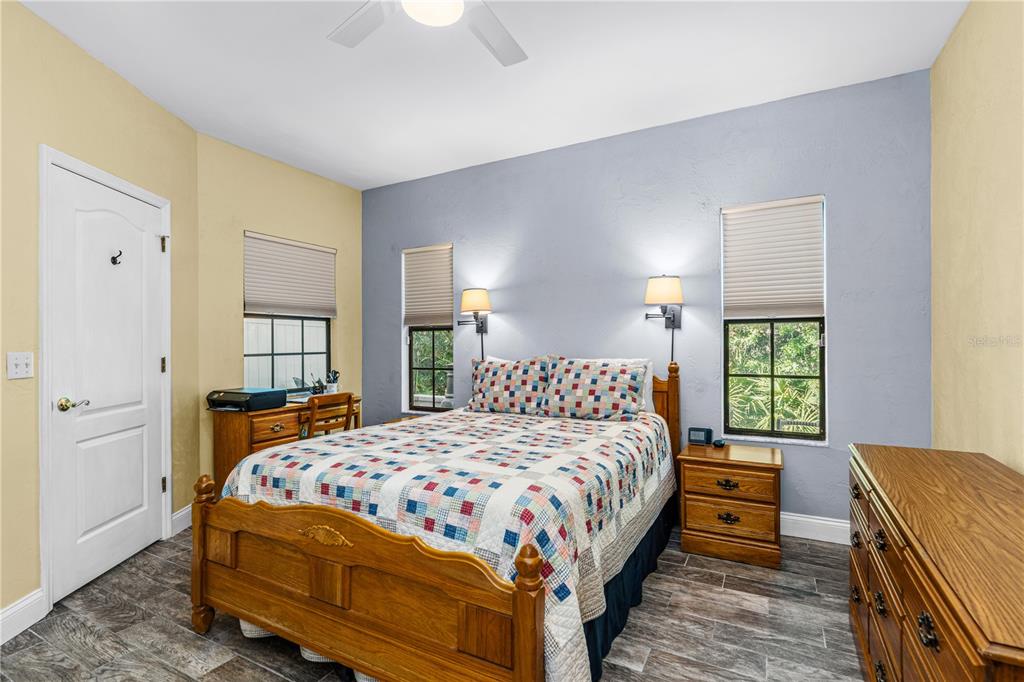 124 Rose Bank Road Daytona Beach, FL 32114 - Photo 28 of 43 a bedroom with a bed and a window