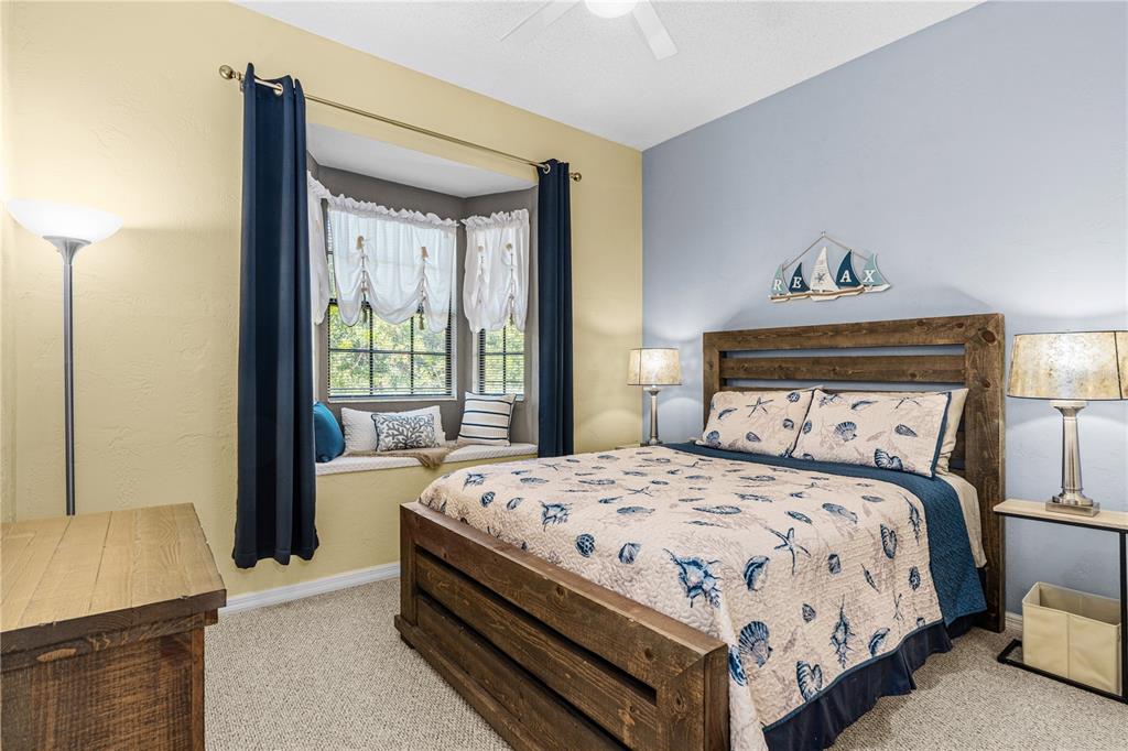 124 Rose Bank Road Daytona Beach, FL 32114 - Photo 32 of 43 a bedroom with a bed and a window