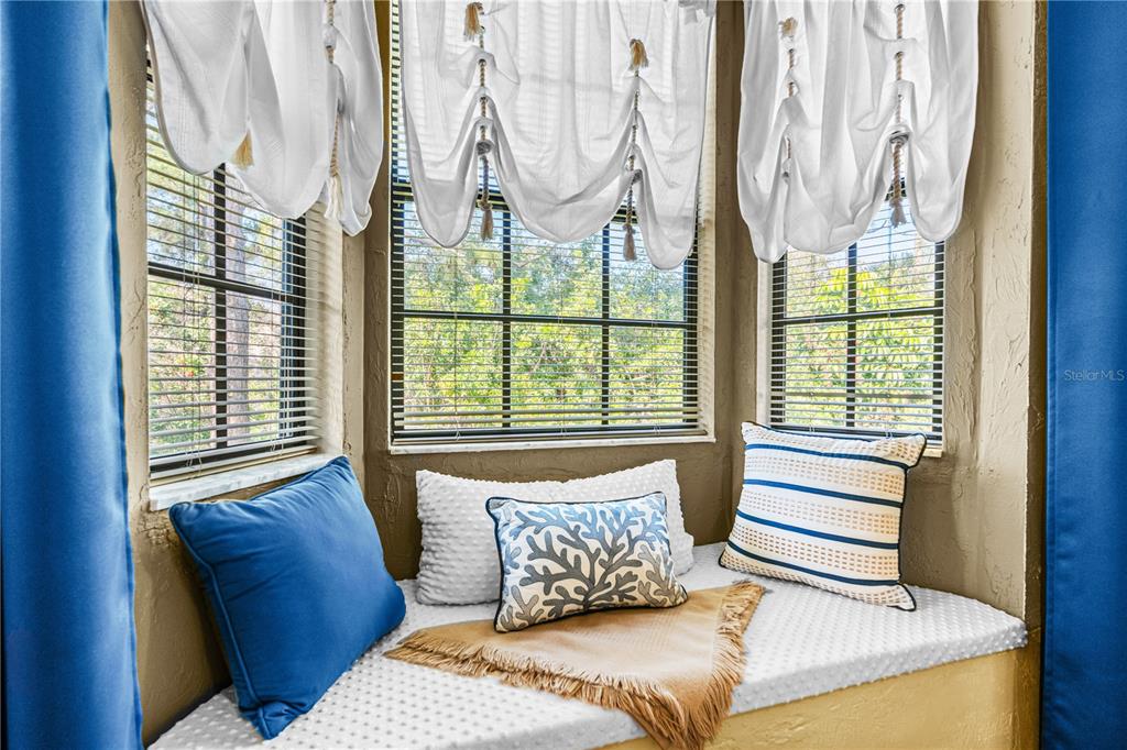 124 Rose Bank Road Daytona Beach, FL 32114 - Photo 33 of 43 a bed sitting in a bedroom next to a window