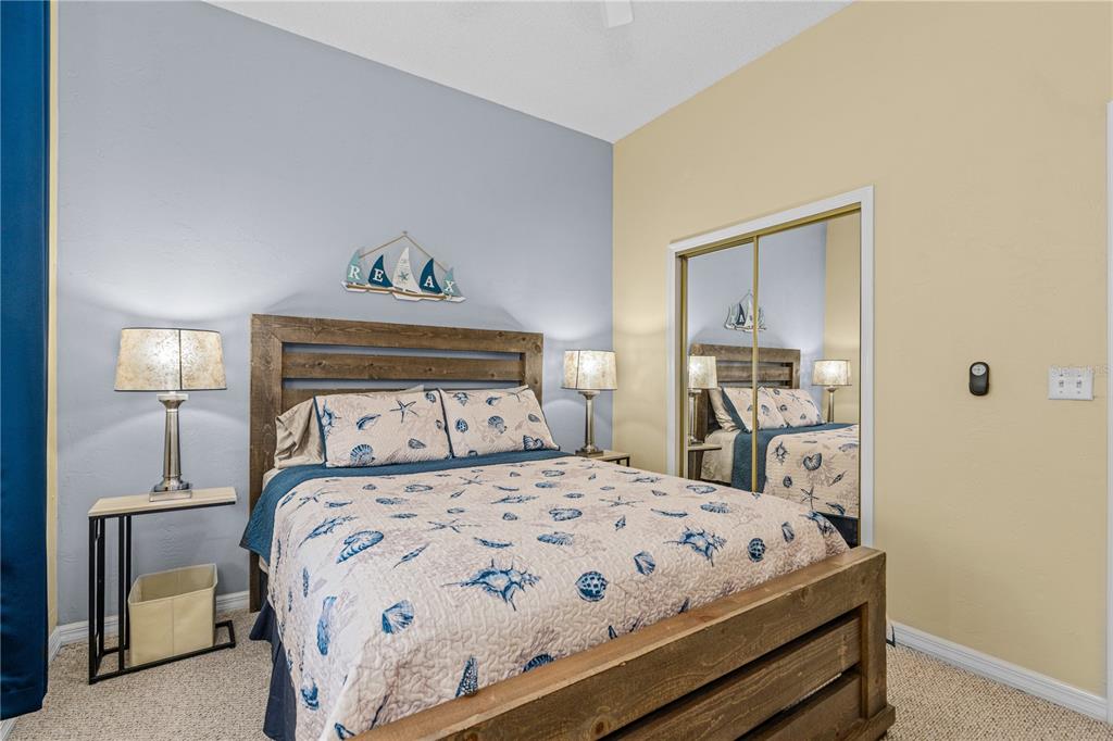 124 Rose Bank Road Daytona Beach, FL 32114 - Photo 34 of 43 a bedroom with a bed and a painting on the wall