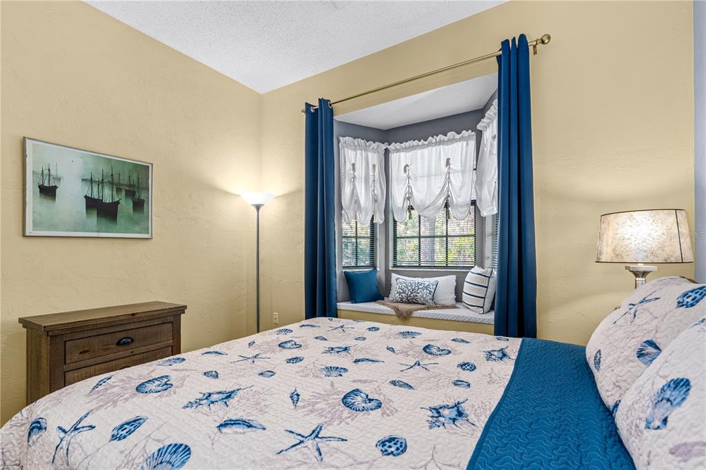 124 Rose Bank Road Daytona Beach, FL 32114 - Photo 35 of 43 a bedroom with a bed and wooden floor